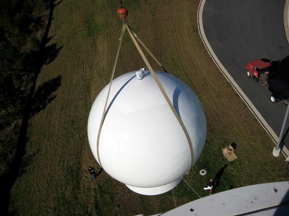 13ft radome being crane-lifted into position